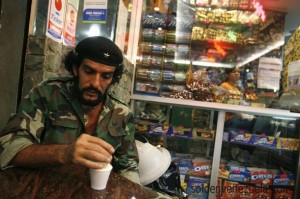 Humberto Lopez, known as "Che" of Caracas drinks coffee in Caracas